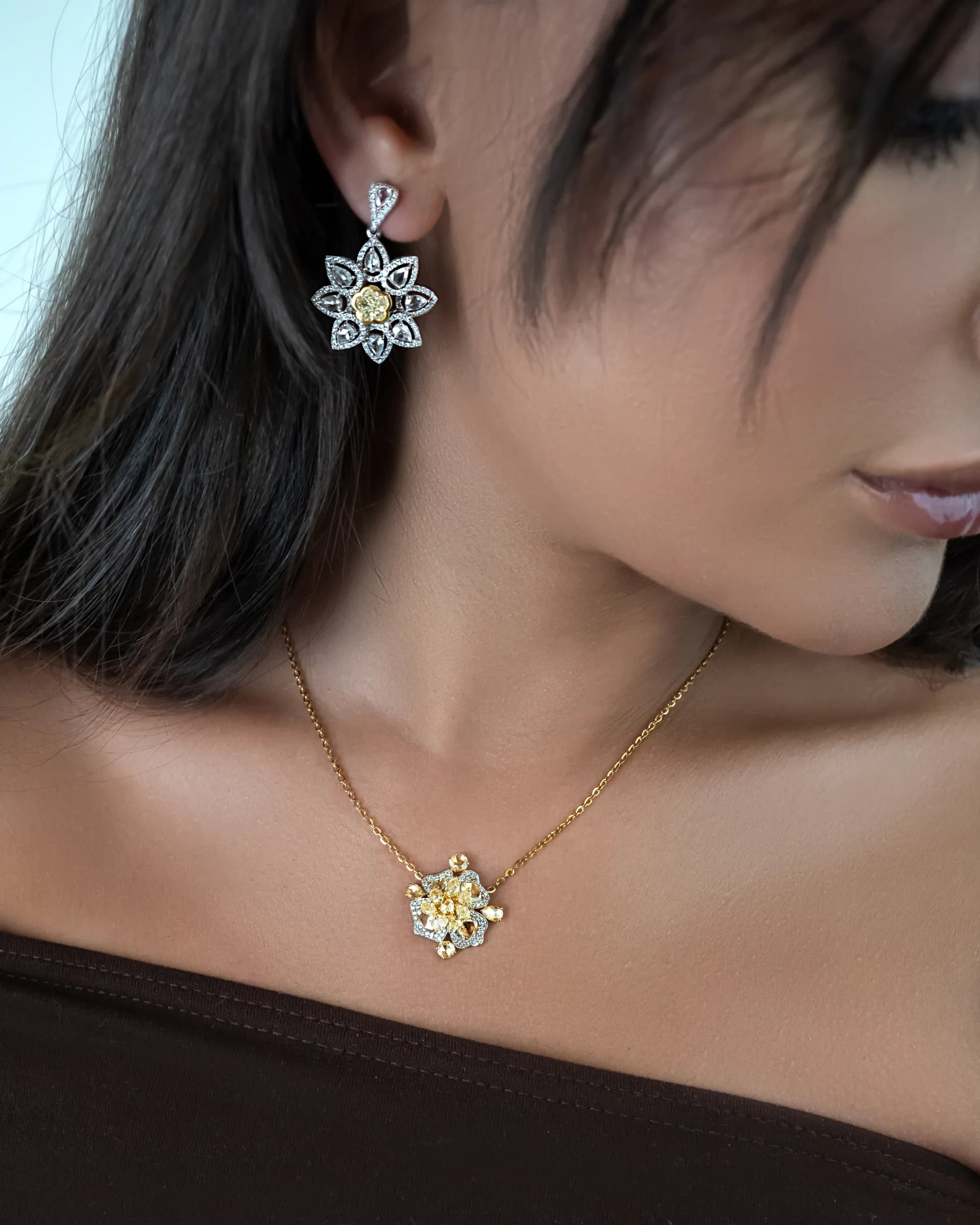 Mozafarian necklace and earring worn in a softly lit portrait