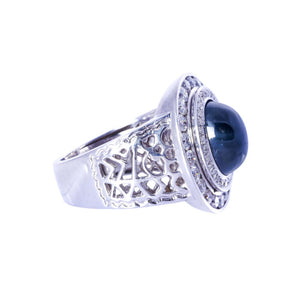 Platinum Gents ring with diamond and center cabochon Sapphire stone.